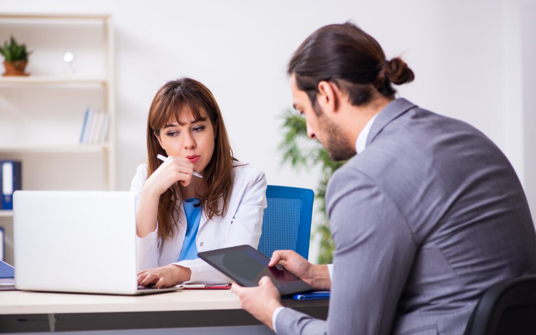 Female doctor and businessman in an office