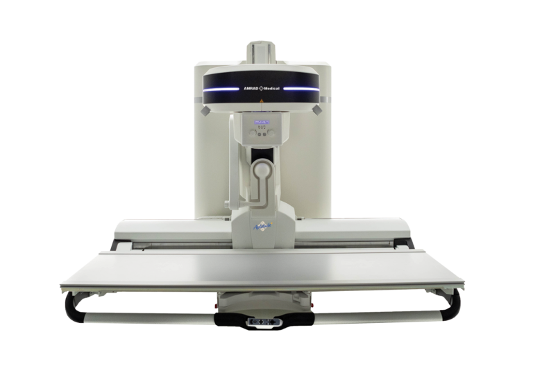 Front view of a large medical imaging machine with a patient table and overhead gantry ready for scans in a clinical setting (amrad medical).