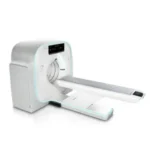 Ct scanner with a patient table extending from the gantry, white with teal accents.