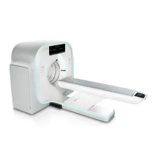 Ct scanner with a patient table extending from the gantry, white with teal accents.