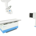 Medical x-ray imaging system with a long examination table and overhead imaging unit on a white background
