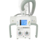 An anesthesia delivery machine with a touchscreen display and gas tubing on a wheeled cart