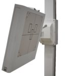 Tilted gray control panel with etched black circuit-like lines mounted on a vertical steel stand.
