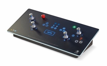 Angled black control panel with several blue-lit buttons, four silver knobs, and a red pushbutton.