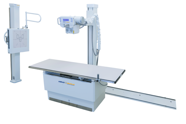 Medical radiography setup with a ceiling-mounted c-arm fluoroscope over an adjustable patient table.