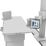 Medical imaging scanner with a patient table and control console visible in a clinical setup.