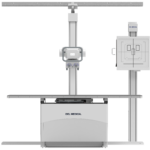 Vertical x-ray imaging system with a ceiling-mounted horizontal beam and a patient table (del medical branding).
