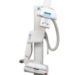 Medical x-ray imaging device on a vertical stand with control panel and cables.