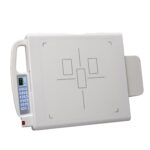 White medical device with a vertical blue-button control panel on the left and a small digital display showing numbers, viewed from the side/top edge