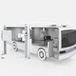 Autonomous white mobile laboratory truck with open service bays and robotic equipment for on-site testing and analysis.