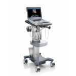 Portable ultrasound machine on a wheeled cart with multiple transducer probes and a monitor displaying an ultrasound image.