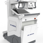 White mobile fluoroscopy/x-ray machine with monitor and control panel, labeled del medical.