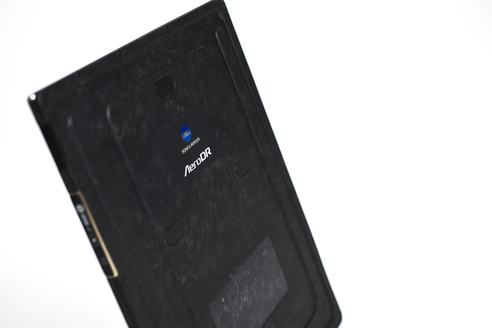 Back of a black aerodr device with a blue konica minolta logo