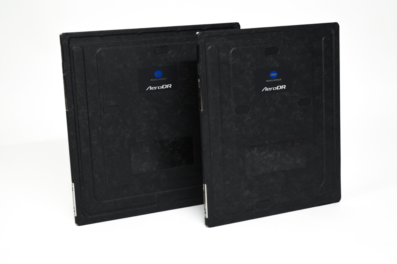 Two black rugged equipment cases standing side by side, each with an aerodr label and blue circular logo on the front panel.