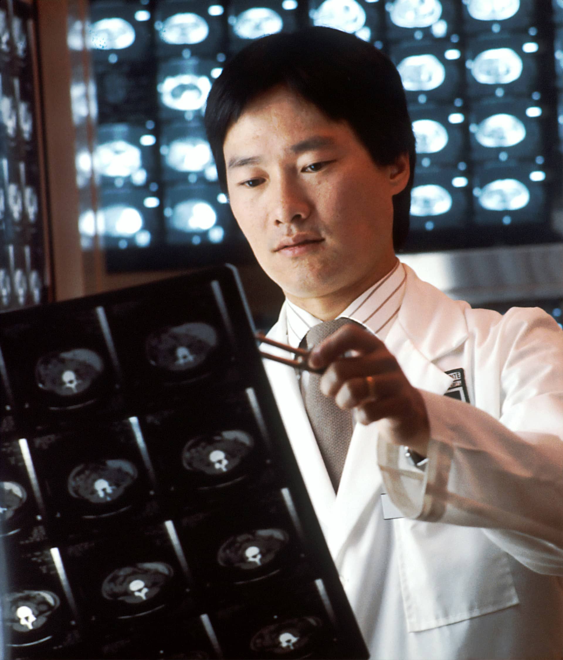 National-cancer-institute-xcn1taj2y0m-unsplash-2-1 A male Asian radiologist looking at computed tomography (CT) scans.