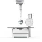 Full-height view of a del medical radiography system with a vertical support gantry, control console, and patient table.