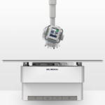 Medical imaging device with a large control panel and table, del medical branding on the base.