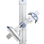 Vertical medical imaging tower with blue accents and an articulated arm, konica minolta logo visible on the top unit