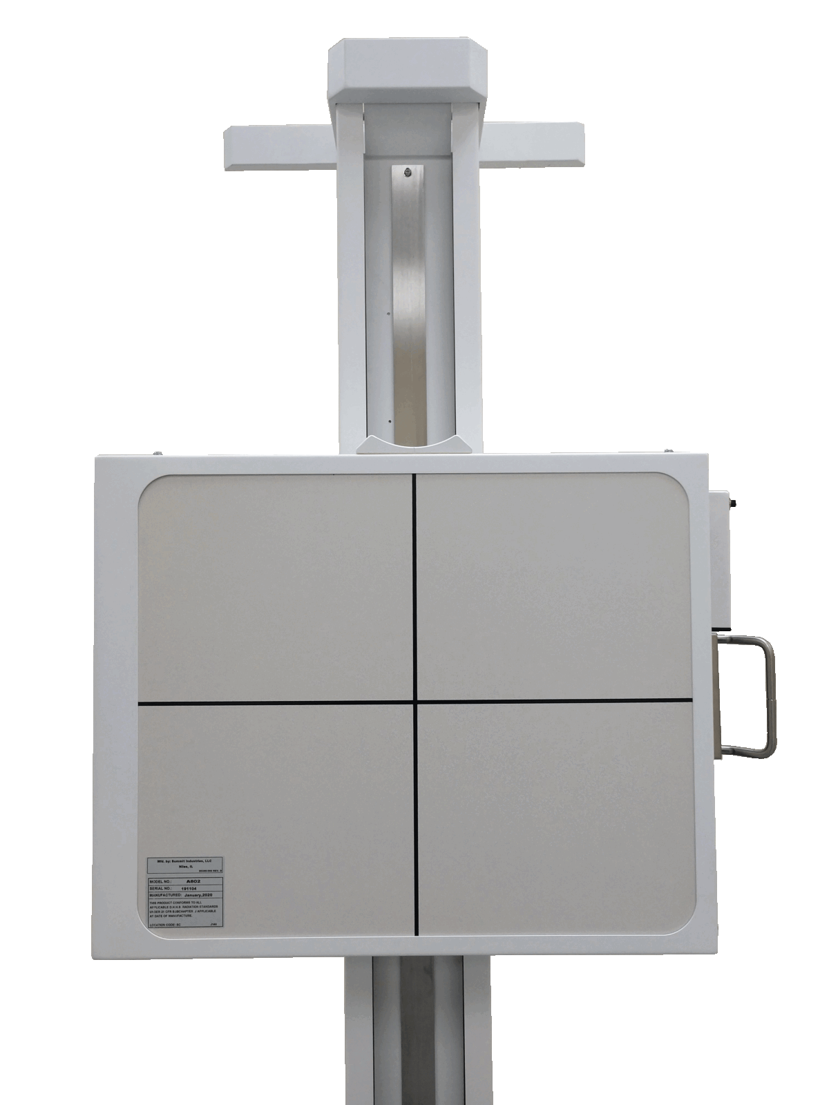 Medical imaging x-ray machine with vertical column and patient table on a beige cabinet.