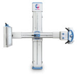 Cross-shaped radiography system with vertical gantry and horizontal beam arm in white and blue accents used for diagnostic imaging.