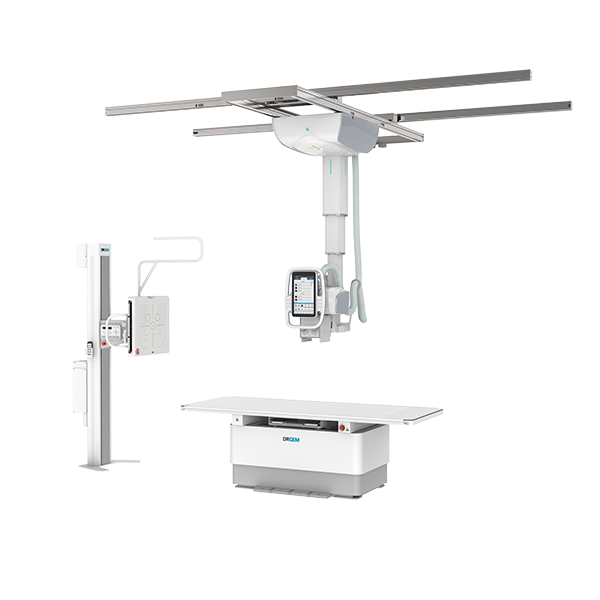Ceiling-mounted x-ray gantry over a patient table with a control monitor in a radiology suite.