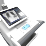 Medical imaging device displaying a chest x-ray on a touchscreen monitor embedded in the machine