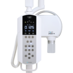 Panoramic dental x-ray machine with a white control panel and arm.