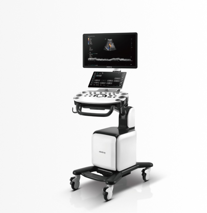 Mobile ultrasound cart with dual screens and a probe tray, used for point-of-care imaging in clinics/wards.