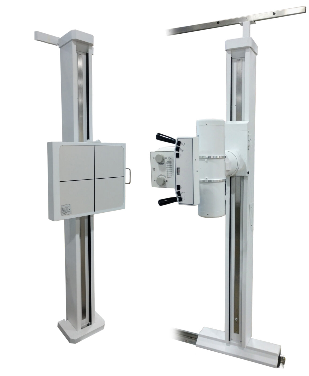 Two vertical radiography stands with a control panel, used for taking x-ray images in a medical setting.