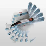 Patient lying on a ct scanner table as the multi-slice imaging device encircles them for a scan.