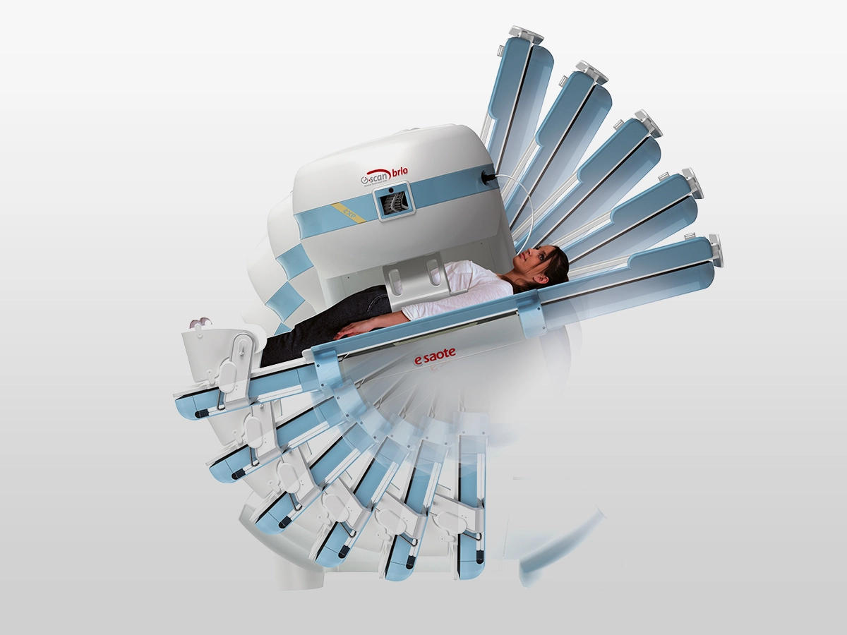 Patient lying on a ct scanner table as the multi-slice imaging device encircles them for a scan.