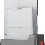 Two vieworks cr/dr plate readers resting in a grey charging dock for imaging plates.