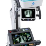 Medical imaging device (x-ray radiography system) with chest x-ray on the screen and control panel nearby